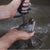 hands pouring graphite